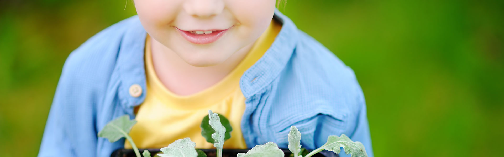 Child holding plant